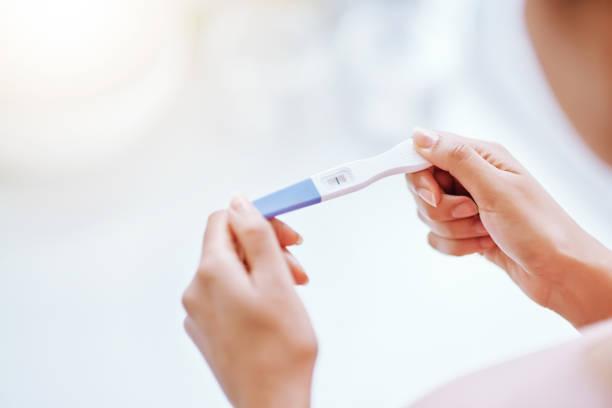 Young Woman Holding a Pregnancy Test